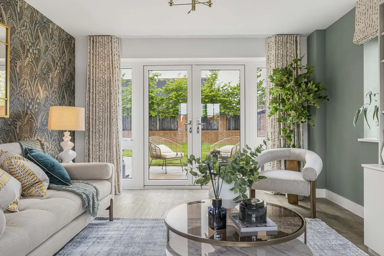 A stylish lounge overlooking at garden at Elgrove Gardens New Build development by Hill