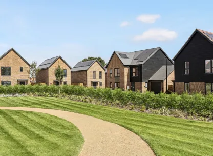 Grounds at Hollymead development with new build detached homes overlooking green space