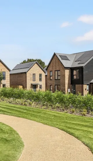 Grounds at Hollymead development with new build detached homes overlooking green space