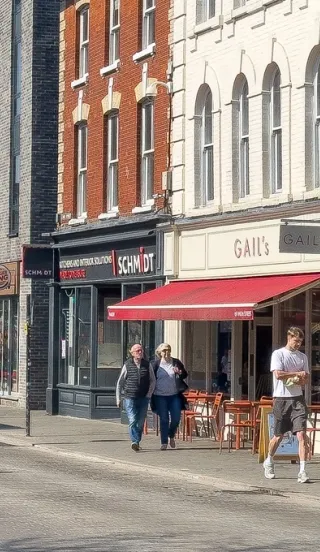 Billericay high street lined with shops in sunny weather