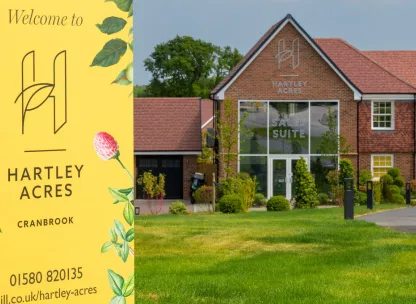 Exterior of Hartley Acres sales suite and sign in Cranbrook