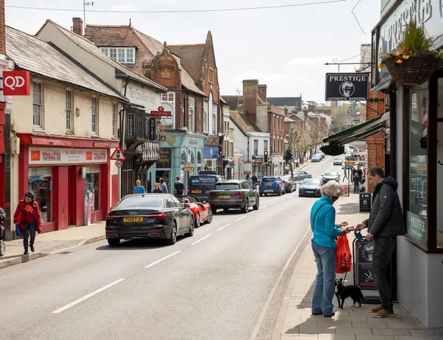 View of Newport high street with cars passing by